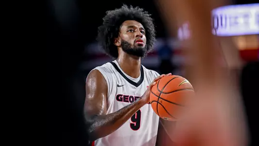 James Scott shoots a free throw in the Georgia Bulldogs' preseason game against Charlotte on October 16 (photo by Sofia Yaker).