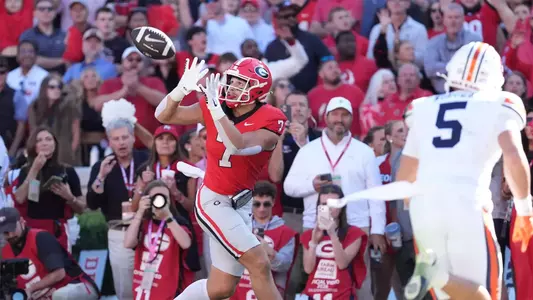 Oct 17, 2026; Athens, Georgia, USA; Georgia tight end Lawson Luckie (7) catches a pass for a touchdown while under pressure from Auburn defensive back Eric Winters (5) during the first quarter at Sanford Stadium. Mandatory Credit: Dale Zanine-Imagn Images