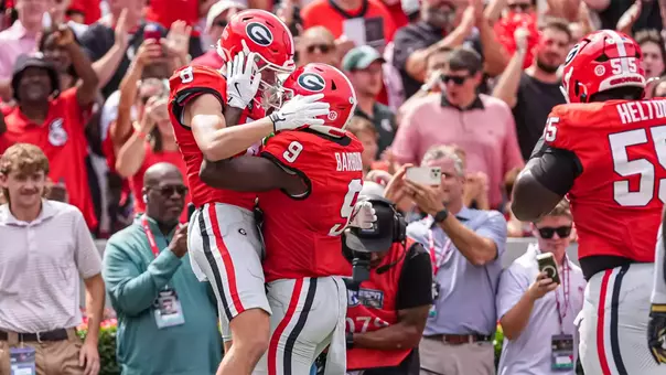 Oct 3, 2026; Athens, Georgia, USA; Georgia Bulldogs wide receiver Landon Roldan (8) reacts with tight end Ethan Barbour (9) after scoring a touchdown against the Vanderbilt Commodores during the first half at Sanford Stadium. Mandatory Credit: Dale Zanine-Imagn Images