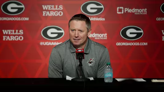 Coach White at presser table