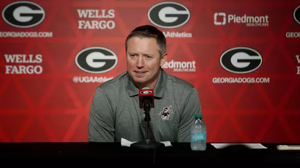 Coach White at presser table