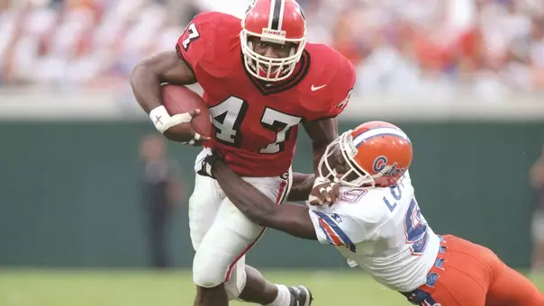 2 Nov 1996: Running back Robert Edwards #47 of the Georgia Bulldogs uses his left arm to fend off the tackle from defensive back Anthone Lott #9 of the Florida Gators while running with the football during a carry in the Bulldogs 47-7 loss to the Florida