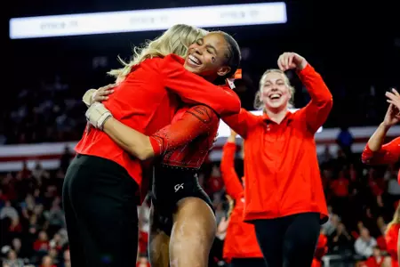 Georgia gymnast Kelise Woolford, Georgia gymnastics head coach Cecile Canqueteau-Landi during Georgia’s quad meet against Temple, Fisk, and Central Michigan at Stegeman Coliseum in Athens, Ga., on Friday, Jan. 30, 2026 (Leila Woods/UGAAA)