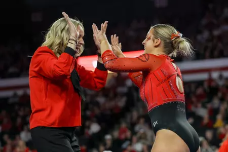 Georgia gymnast Avery Moll, Georgia gymnastics head coach Cecile Canqueteau-Landi during Georgia’s quad meet against Temple, Fisk, and Central Michigan at Stegeman Coliseum in Athens, Ga., on Friday, Jan. 30, 2026 (Leila Woods/UGAAA)