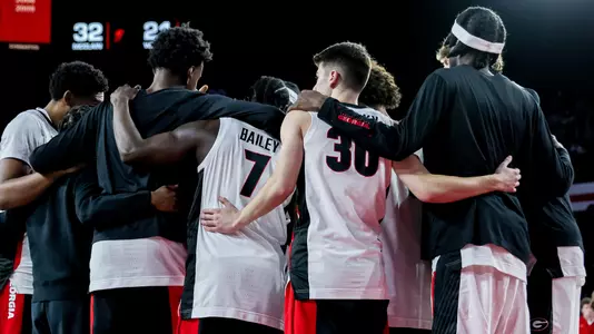 Team huddle before Florida A&M game (photo by Conor Dillon).