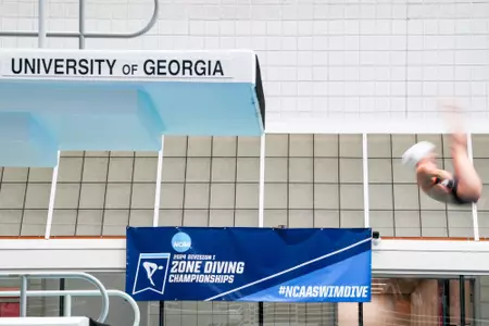 A diver competes at the 2024 NCAA Zone B Diving Championships at Bauerle Pool at Gabrielsen Natatorium.