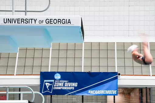 A diver competes at the 2024 NCAA Zone B Diving Championships at Bauerle Pool at Gabrielsen Natatorium.