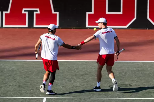 Gabriele Vulpitta and Will Jansen high five on doubles court two