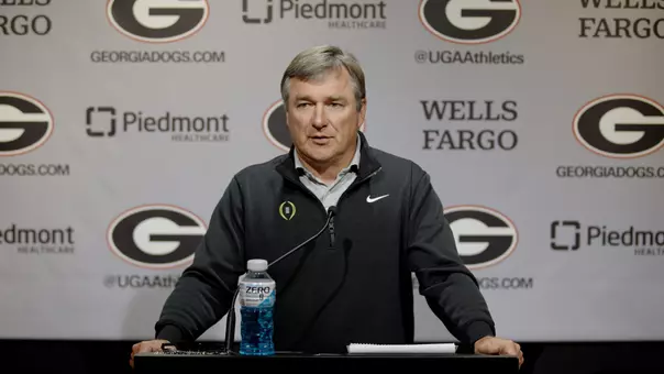 Coach Smart at podium