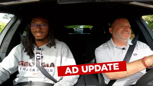 AD Josh Brooks and Track and Field athlete Jonathan Simms riding in a car for the BMW AD Update.