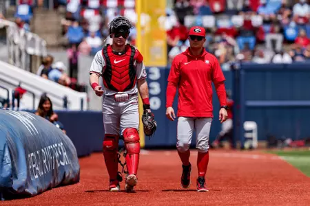 Georgia catcher and outfielder Daniel Jackson (3), Georgia assistant coach and recruiting coordinator Brock Bennett before Georgia’s game against Ole Miss at Swayze Field in Oxford, Ms., on Saturday, April 25, 2026. (Conor Dillon/UGAAA)