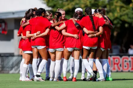 The Georgia soccer team huddles before its exhibition against Auburn on August 5.