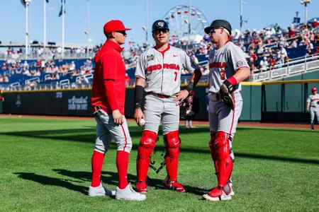 Georgia assistant coach and recruiting coordinator Brock Bennett, Georgia catcher and outfielder Jack Arcamone (7), Georgia catcher and outfielder Daniel Jackson (3) before Georgia’s game against Oklahoma in the 2026 College World Series at Charles Schwab Field in Omaha, Ne., on Monday, June 15, 2026. (Conor Dillon/UGAAA)