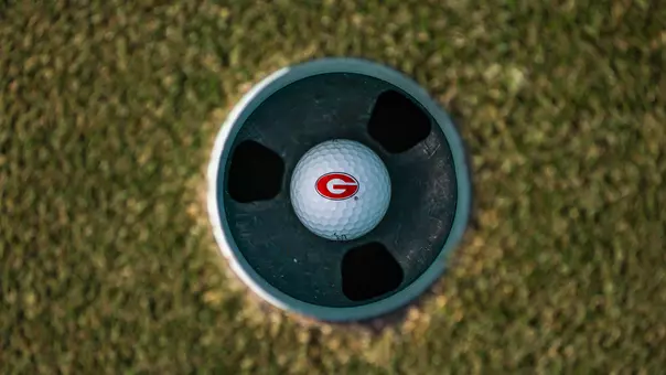 Shot of Georgia "G" golf ball in cup (photo by Conor Dillon).