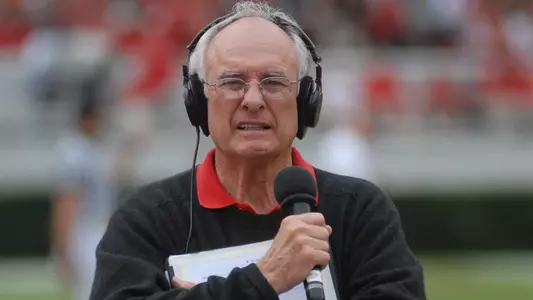 Loran Smith on the sidelines of a Georgia football game.