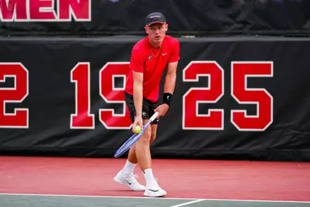 Noah Johnston during an NCAA match in Athens against Elon.