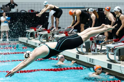 A Georgia women's swimmer enters the pool during a race against Tennessee on Jan. 23, 2026.