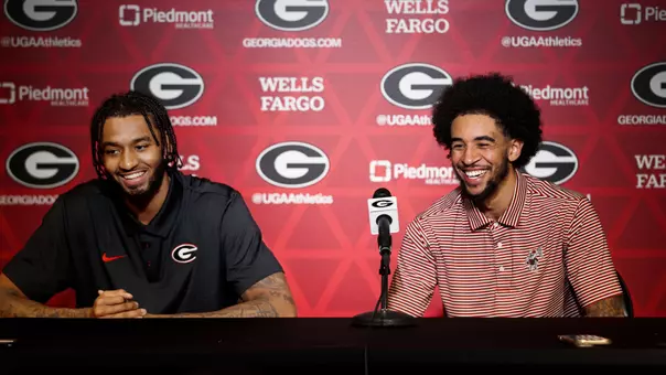 James Scott and Freddie Dilione V smiling at podium