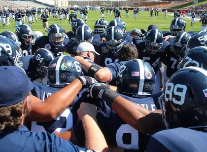Eagle Football lineman huddle during pregame