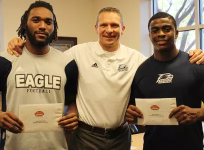 Lavelle Westbrooks, Coach Jeff Monken and Jerick McKinnon