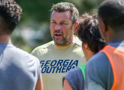 GS Men's Soccer head coach John Murphy talks to his team at practice 8/7