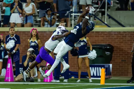 Derwin Burgess catches a touchdown pass during the second half of the NCAA football game between Georgia Southern and James Madison at Allen E. Paulson Stadium on October 15, 2022 in Statesboro, Georgia. (Photograph by AJ Henderson/ Georgia Southern Athletics)