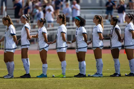 Georgia Southern players during the national anthem before the NCAA women’s soccer match between Georgia Southern and App State at Eagle Field at the Erk Russell Athletic Park on October 9, 2022 in Statesboro, Georgia. (Photograph by AJ Henderson / Georgia Southern Athletics)