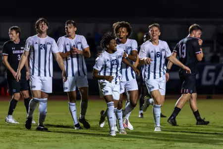 Georgia Southern men's soccer players celebrate with Ty Wilson (23) after he scores a goal to take a 1-0 lead against South Carolina at Eagle Field on Wednesday, Oct. 18, 2023. The match ended in a 1-1 draw.