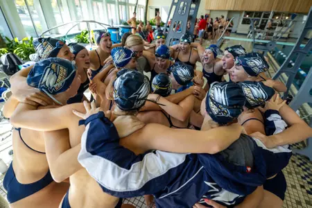 Team huddle during the NCAA swimming meet between Georgia Southern, Gardner-Webb and SCAD at RAC Pool on October 7, 2023 in Statesboro, Georgia. (Photograph by AJ Henderson / Georgia Southern Athletics)