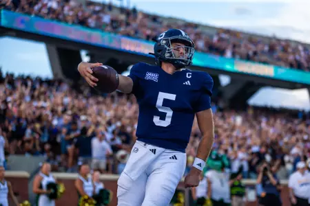 Georgia Southern quarterback Davis Brin scores a rushing touchdown during an NCAA football game between the Eagles and the UAB Blazers.