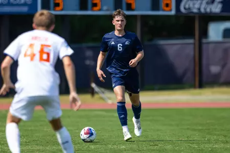 Toby Nevile takes the ball across the pitch in an exhibition match against Clayton State on August 19, 2023.