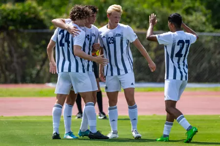 Georgia Southern men's soccer celebrates a goal with Jack Ireland (24) to take a 1-0 lead in the second half against UNC Asheville on August 27.