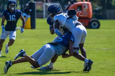 Players collide during Georgia Southern Football Practice at Beautiful Eagle Creek on August 8, 2023 in Statesboro, Georgia. (Photograph by AJ Henderson, Georgia Southern Athletics)