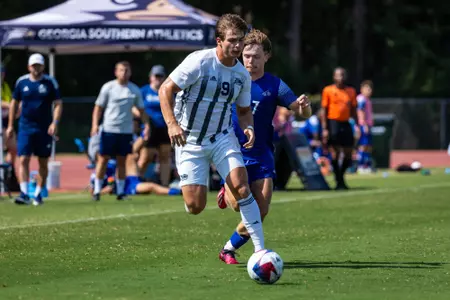 Georgia Southern striker Zachary Martin (9) takes a ball upfield during an NCAA men's soccer match against UNC Asheville on Sunday, Aug. 27, at Eagle Field.