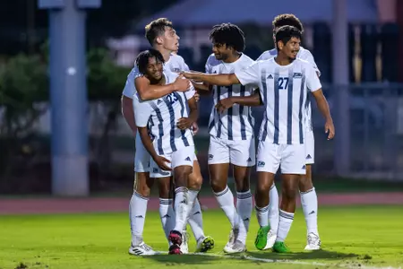 Members of the Georgia Southern men's soccer team celebrate with freshman Ty Wilson (23) after he scores the first goal of his collegiate career against Mercer on Tuesday, Sept. 19, 2023.