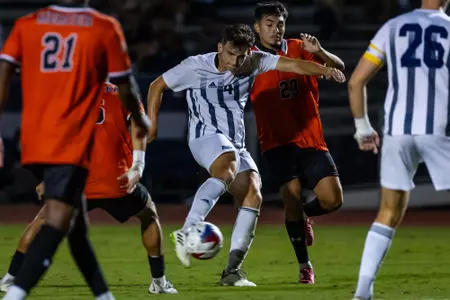Georgia Southern forward AJ Pama (4) shoots from the middle of a crowd of Mercer Bears players in an NCAA men's soccer match between Georgia Southern and Mercer on Tuesday, Sept. 19, 2023.