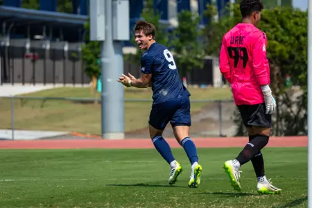 Georgia Southern men's soccer forward Zachary Martin applauds himself after scoring a goal against Clayton State in a preseason exhibition match on Saturday, Aug. 19.