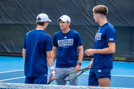 Georgia Southern Men's Tennis head coach Andrew Goodwin, Georgia Southern sophomore Matthew Mitchell and Georgia Southern junior Pol Del Castillo during the NCAA men’s tennis match between Georgia Southern and James Madison at Wallis Tennis Center on March 23, 2024 in Statesboro, Georgia. (Photograph by Dan Groover / Georgia Southern Athletics)