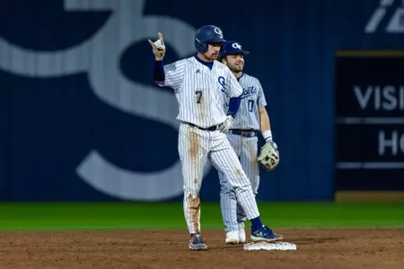 Josh Tate celebrates stealing a base against Georgia Tech on Feb. 20, 2024.