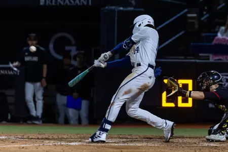 Georgia Southern third baseman Jarrett Brown swings at a pitch during an NCAA baseball game against the Maryland Terrapins on February 16, 2024.