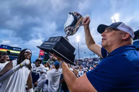 Georgia Southern Football head coach Clay Helton accepts the Commissioner's Cup following the NCAA football game between Georgia Southern and Georgia State at Center Parc Stadium on September 28, 2024 in Atlanta, Georgia. (Photograph by AJ Henderson / Georgia Southern Athletics)