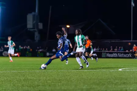 Ezra Amadi-Emina kicking a ball in a game against Marshall