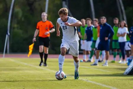 Charlie Votel dribbling a ball vs West Virginia
