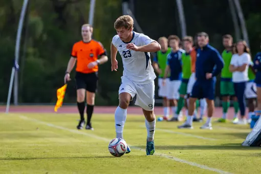 Charlie Votel dribbling a ball vs West Virginia