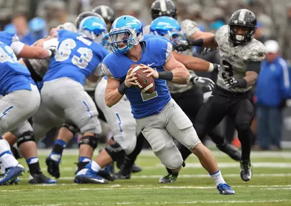 Quarterback Kale Pearson (2) rolls out to pass during the first half.