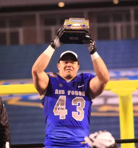 Shayne Davern raising the MVP trophy.