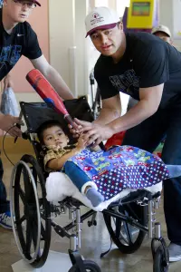 Air Force baseball's Brian Sicher and Seth Kline with a patient.