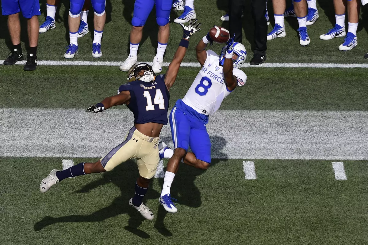 Air Force Falcons wide receiver Marcus Bennett (8) catches a pass over Navy Midshipmen cornerback Elijah Merchant (14) during the first quarter at Navy-Marine Corps Memorial Stadium. Tommy Gilligan-USA TODAY Sport