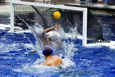 U.S. Air Force Academy -- Jack Alexander scores a goal against Concordia's Alberto Gonzalez during the Sep. 15, 2018 Western Water Polo Association conference opener at the Cadet Natatorium, here. Air Force won the contest by a score of 19-11. (U.S. Air Force photo/Bill Evans)