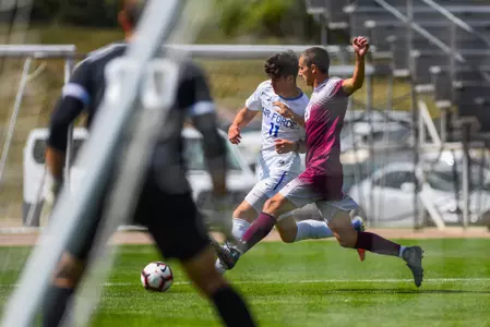 U.S. Air Force Academy -- Air Force Falcons Aaron Uribe, midfielder, drives toward the goal while Colgate Raiders Oliver Harris, midfielder, defends during their match up at the Falcon Soccer Stadium Sep. 9, 2018. Falcons went on to win the game 3-0. (U.S. Air Force photo/Christopher DeWitt)
